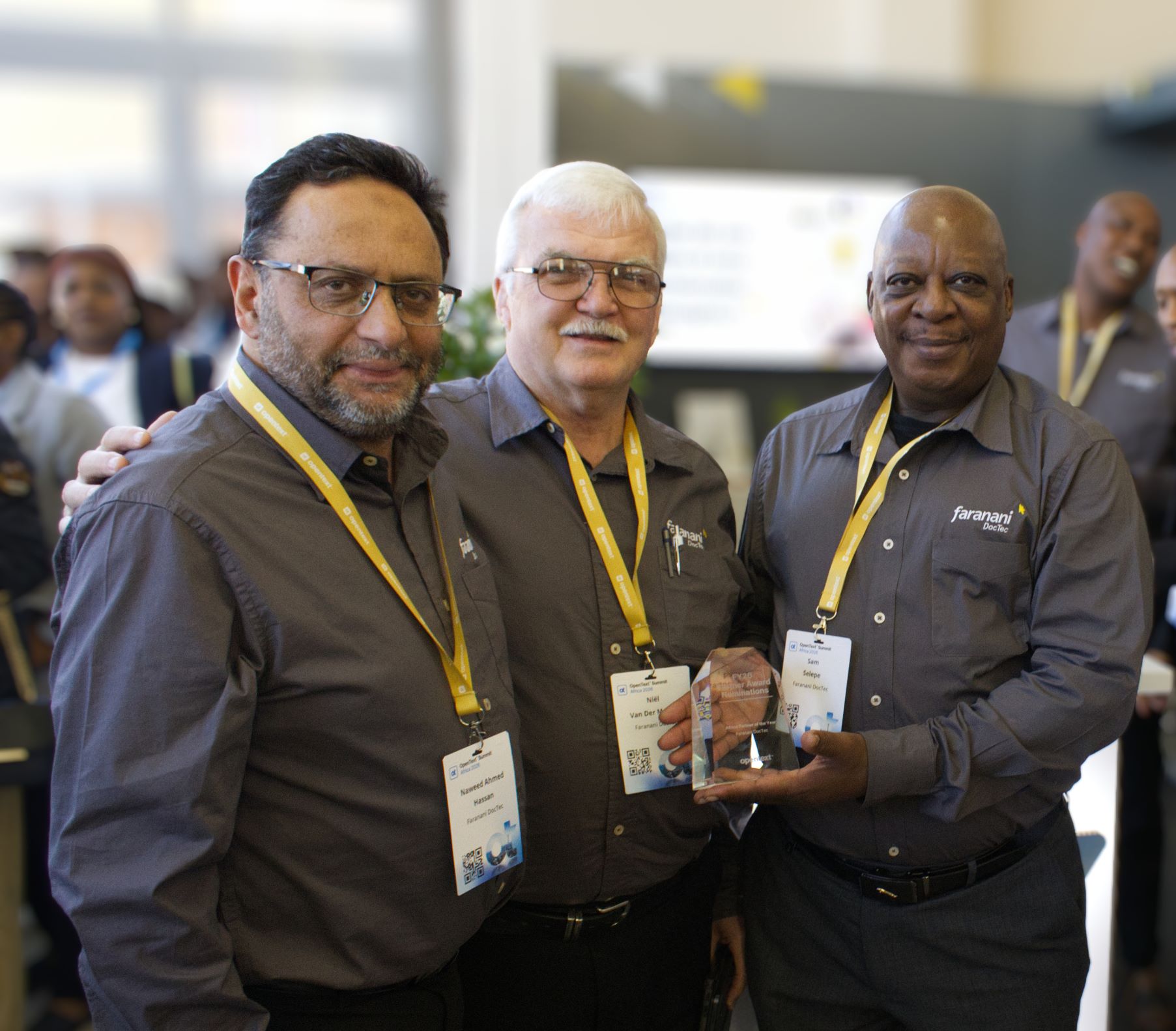 Faranani DocTec Chairman Naweed Hassan, Chief Executive Officer Niël van der Merwe and Sales Director Sam Selepe with the OpenText Africa Partner of the Year 2026 award at OpenText Summit Africa 2026.